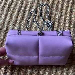 A new day small purple purse with silver long chain 9” X 5 1/2”x 2 1/2”